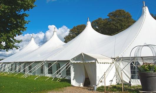 a line of sleek and modern portable restrooms ready for use at an upscale corporate event in Orange City